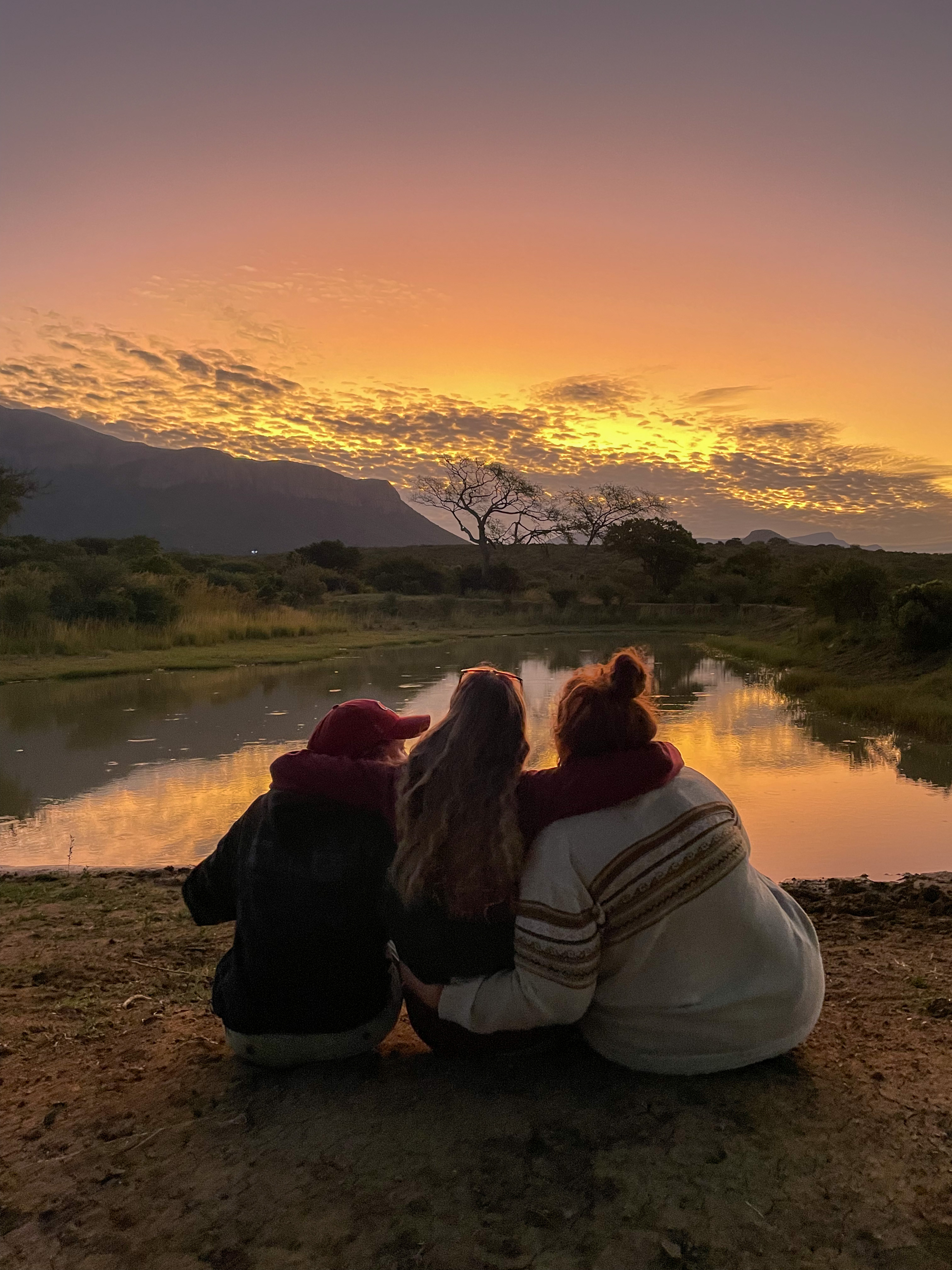 Gap year wildlife conservation - Gap year experiences - Sunset photo three volunteers very happy