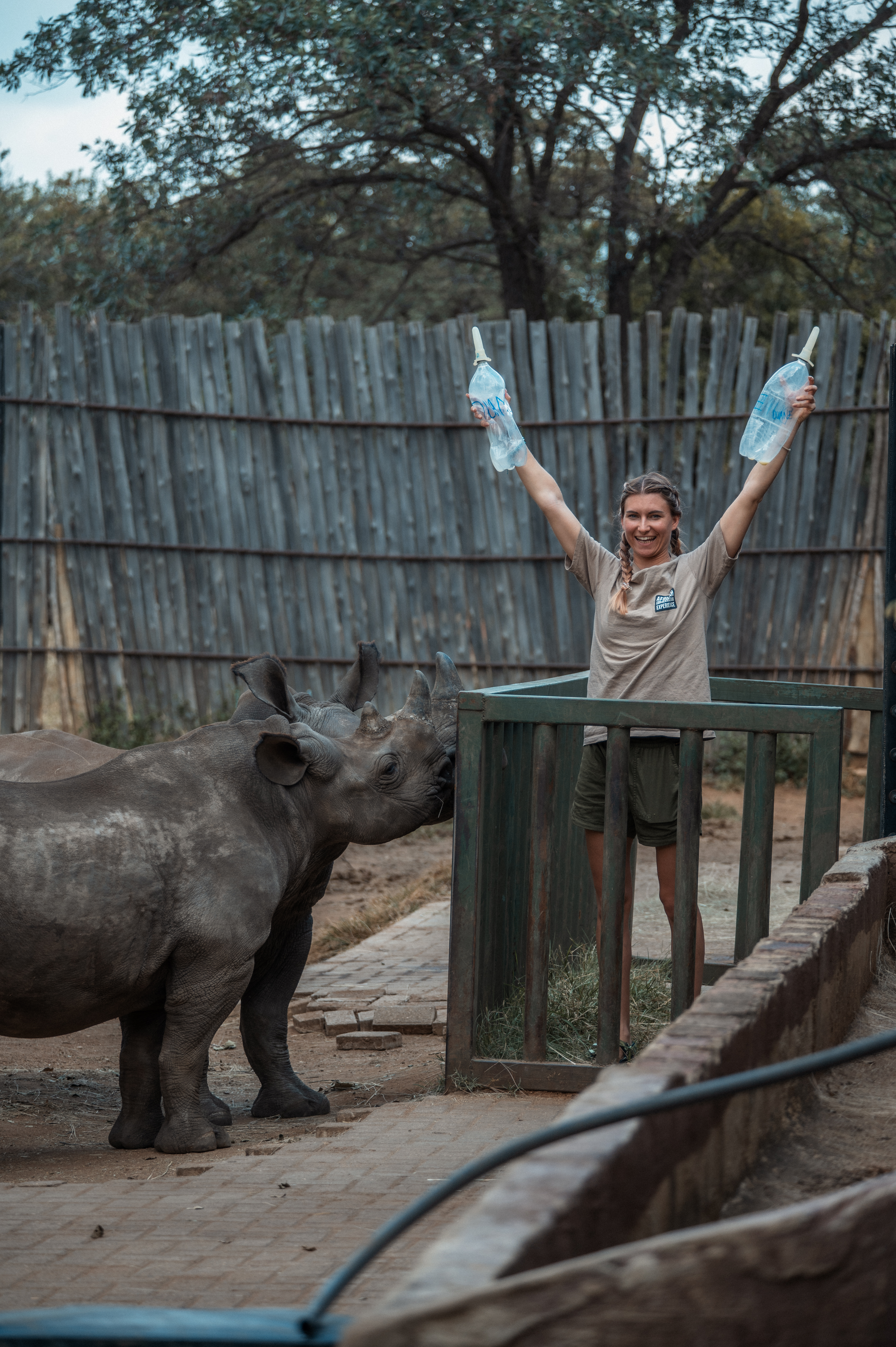 Rhino Conservation Experience - volunteer celebrating feeding a baby rhino