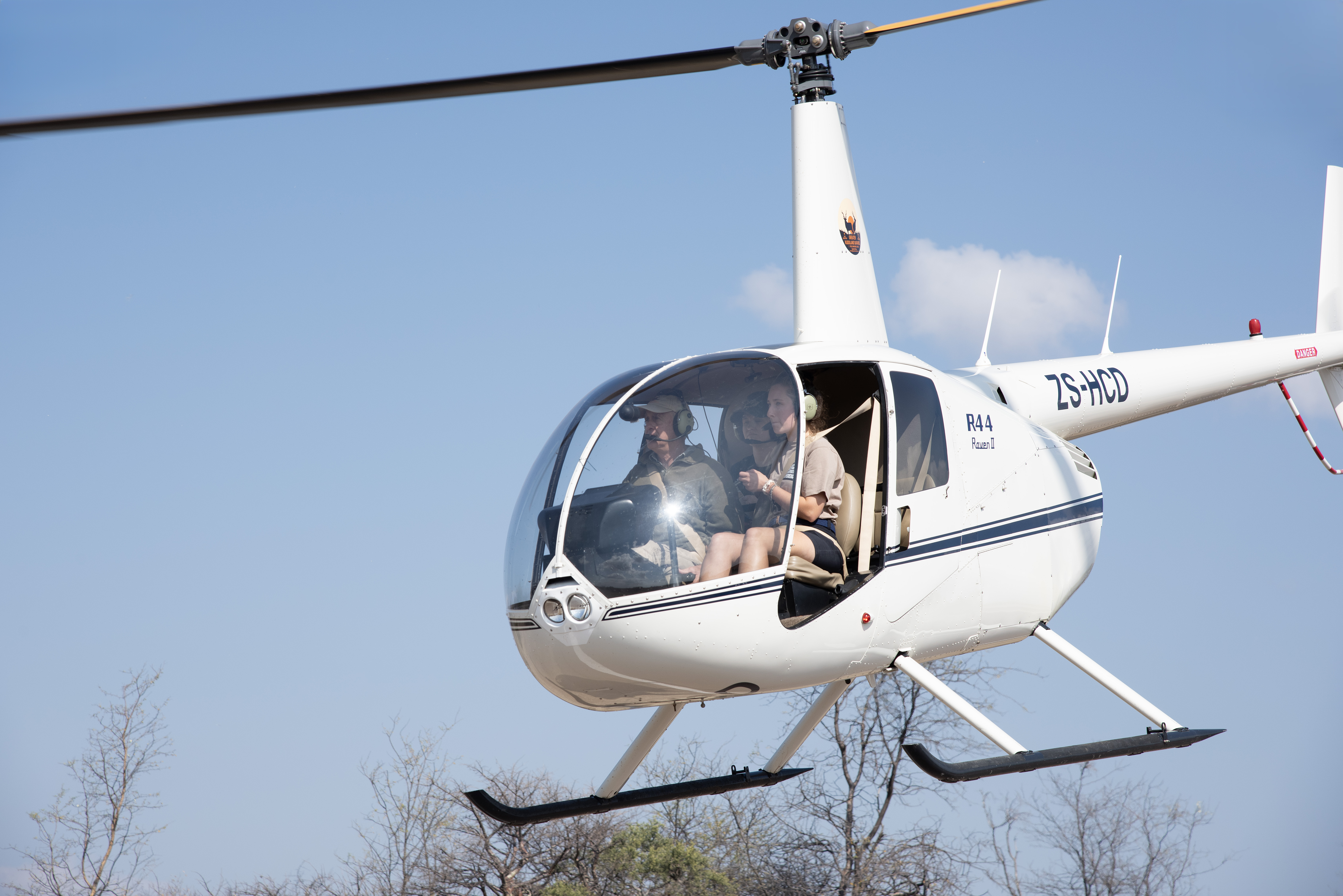 The Savannah Veterinary Explorer - volunteer in a helicopter