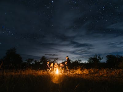 The ‘All In’ Gap Year Experience - volunteers hanging out by a campfire