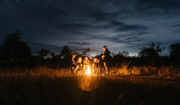 The ‘All In’ Gap Year Experience - volunteers hanging out by a campfire