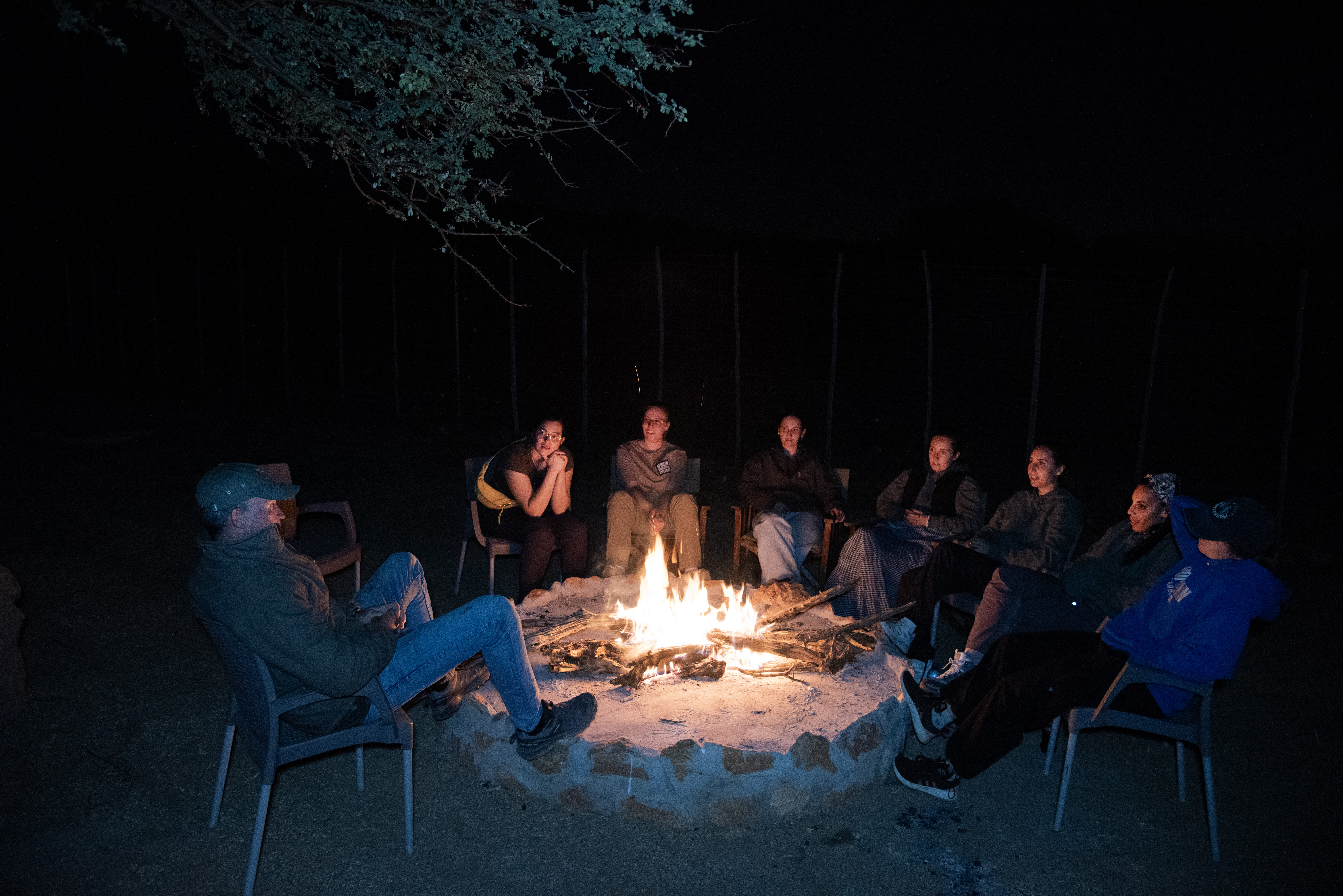 The ‘All In’ Gap Year Experience - volunteers relaxing by a campfire