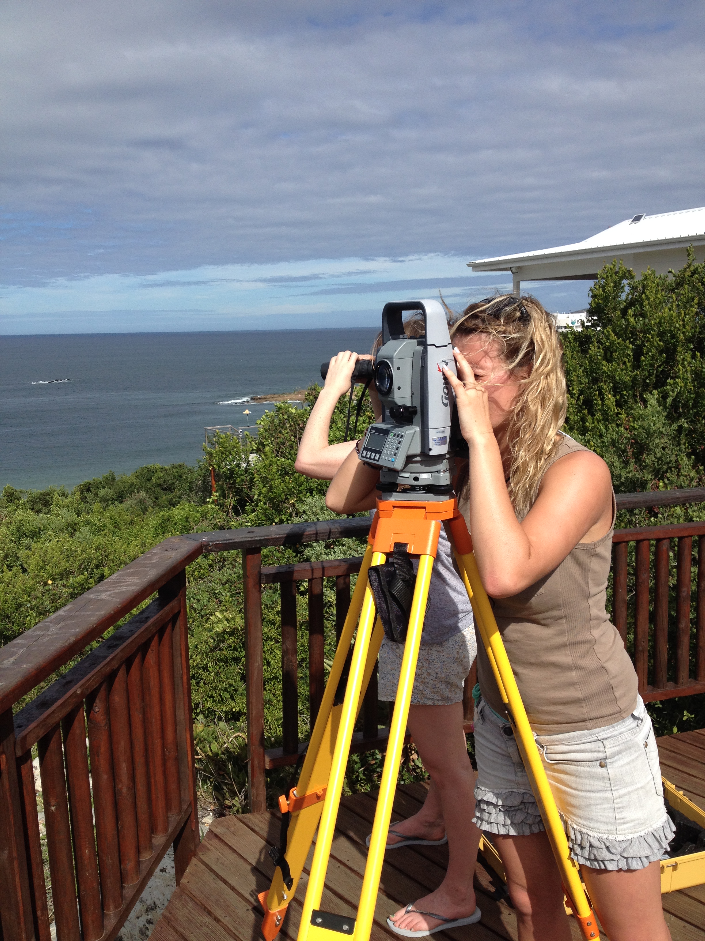 Coastal Conservation Project - volunteer looking through a telescope 