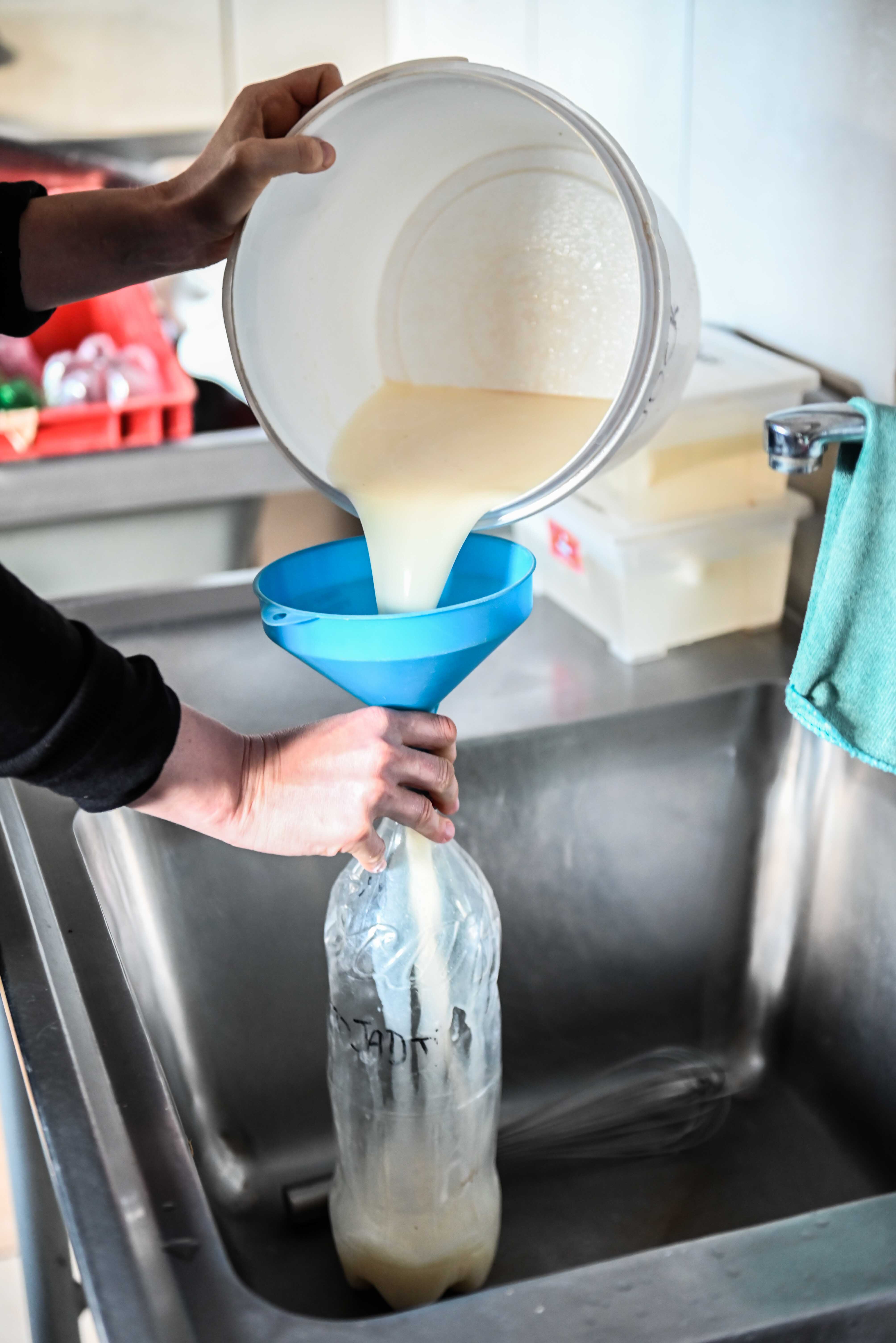 Care For Wild Africa Rhino Sanctuary - volunteer preparing rhino milk