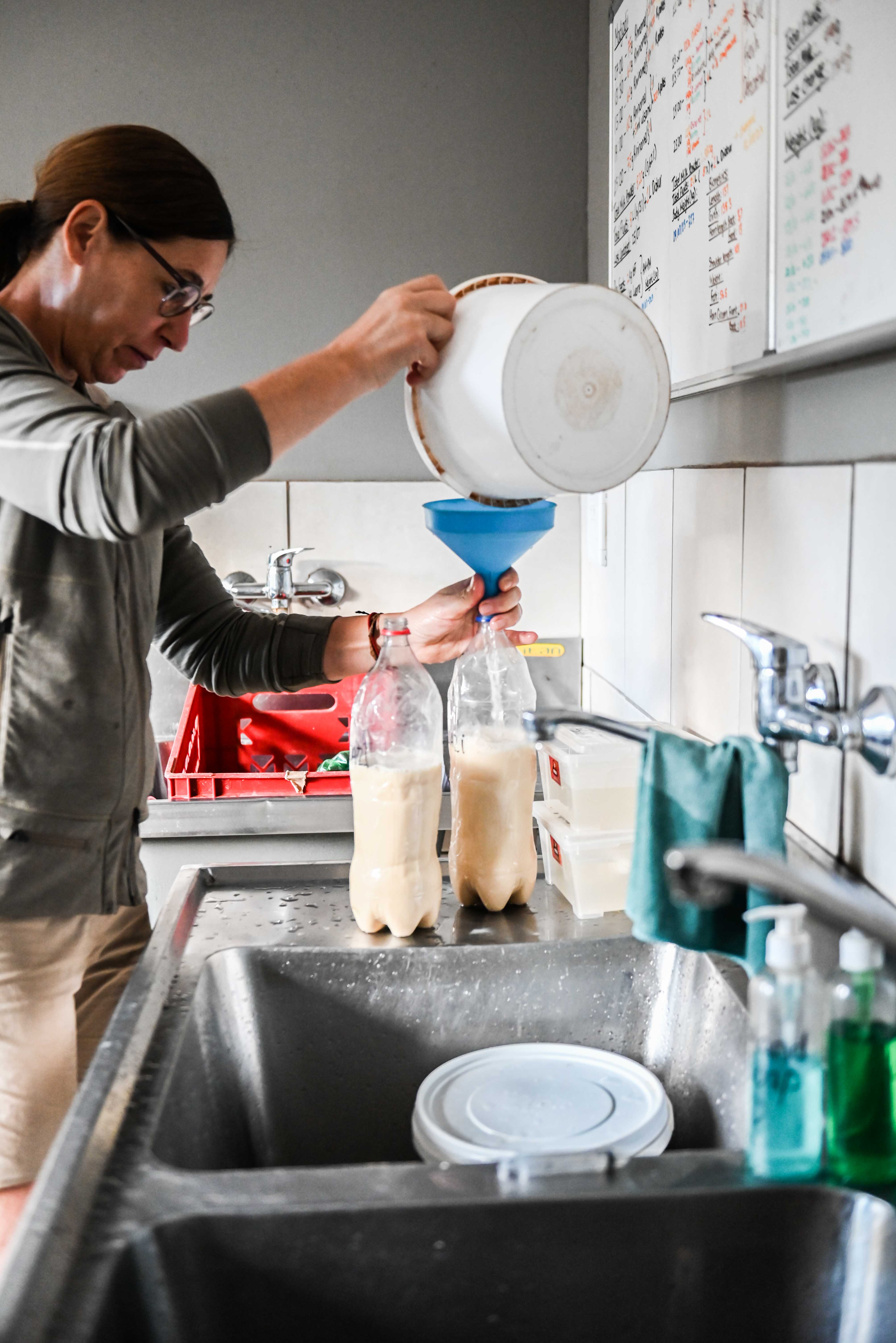 Care For Wild Africa Rhino Sanctuary - volunteer preparing rhino milk