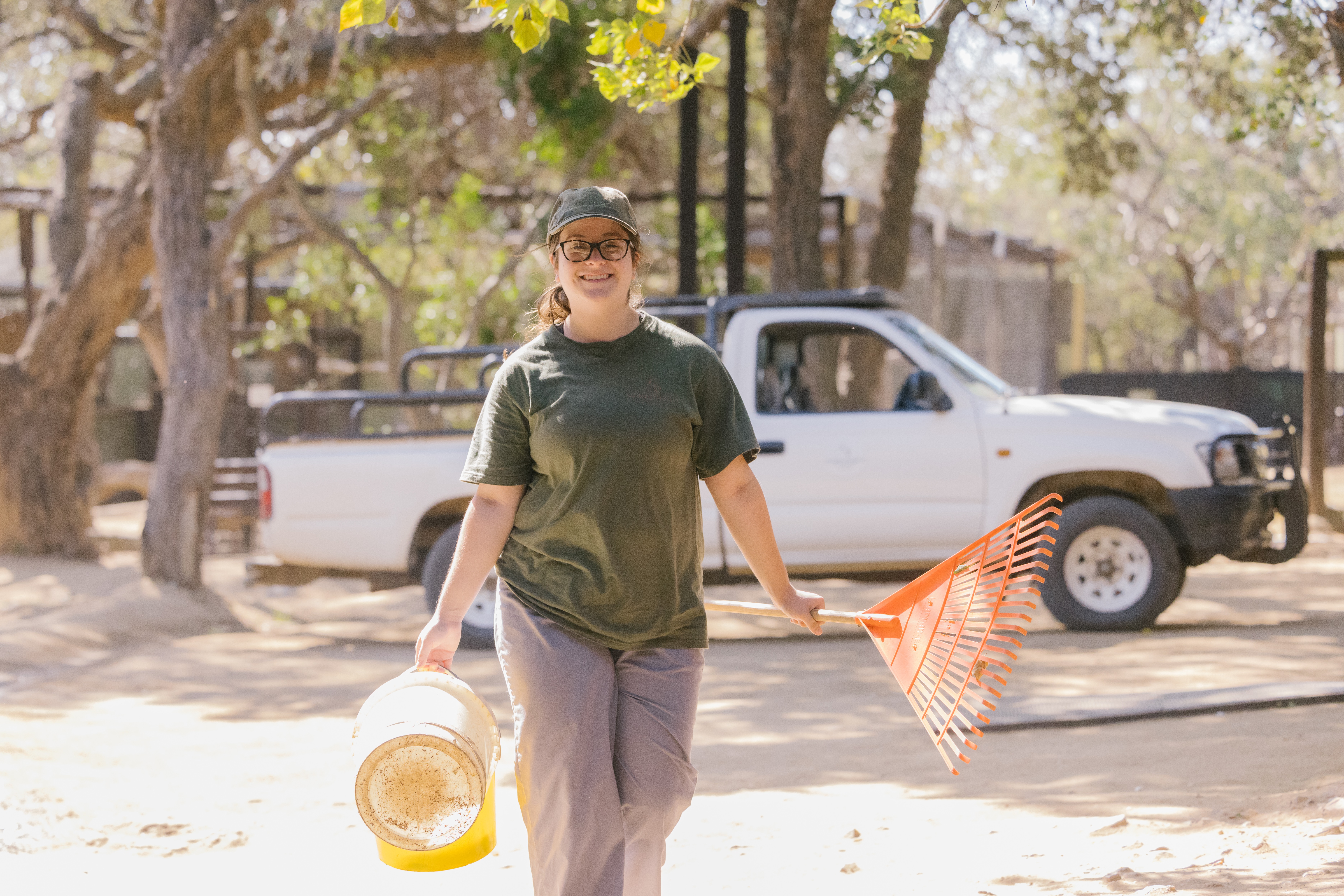 Wildlife Rehabilitation Placement - volunteer carrying cleaning equiptment