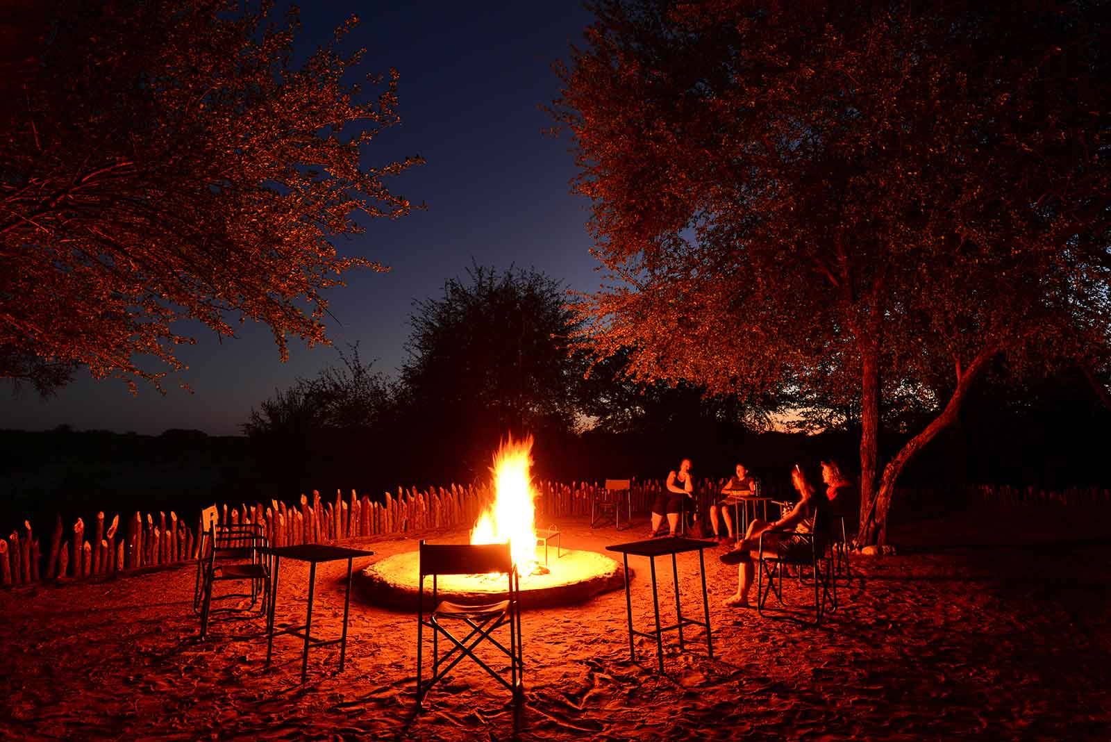 Okavango Wilderness Project - volunteers by the campfire