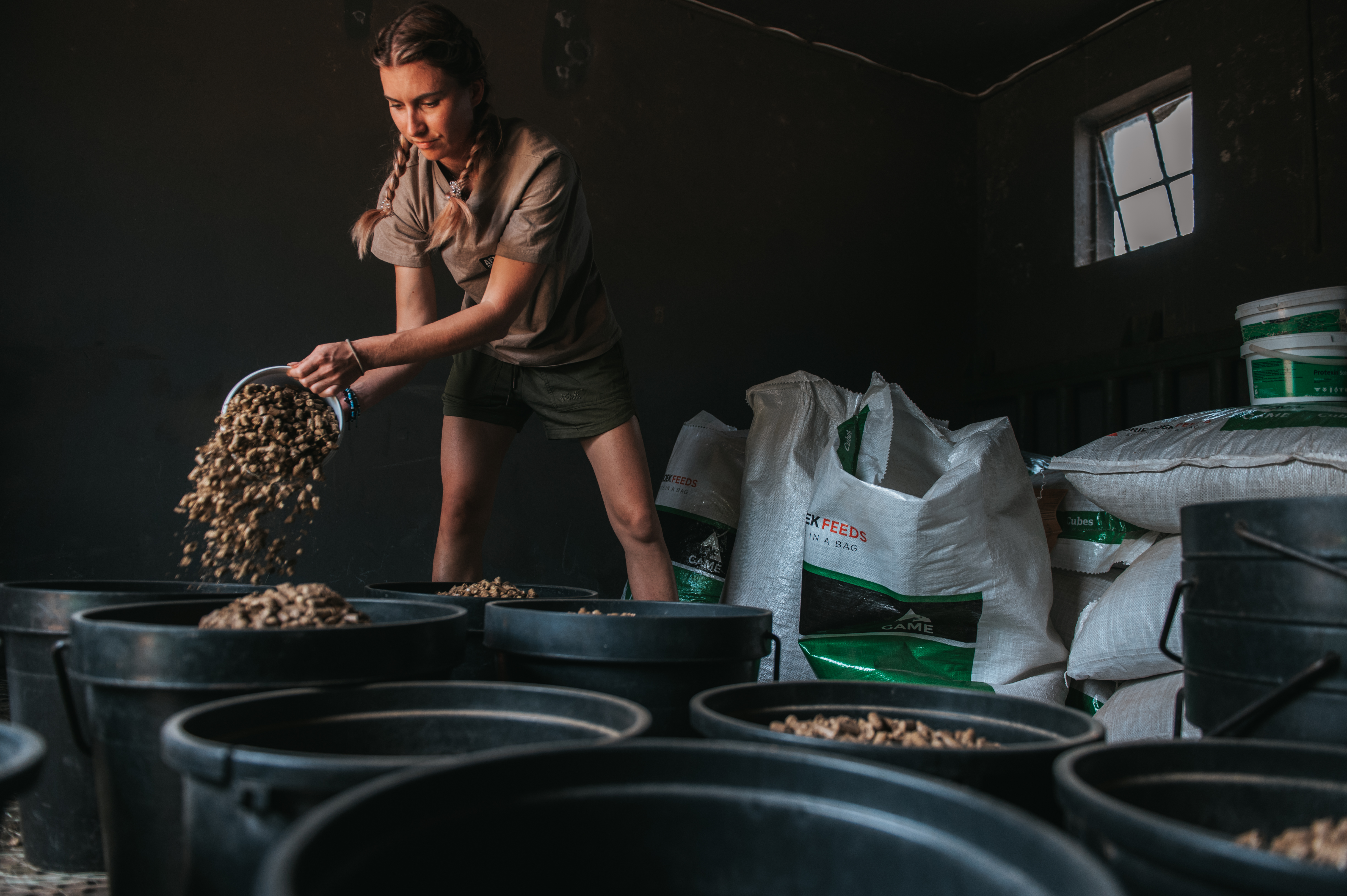 Golola Rhino Orphanage and Rehabilitation Centre - volunteer preparing food buckets 