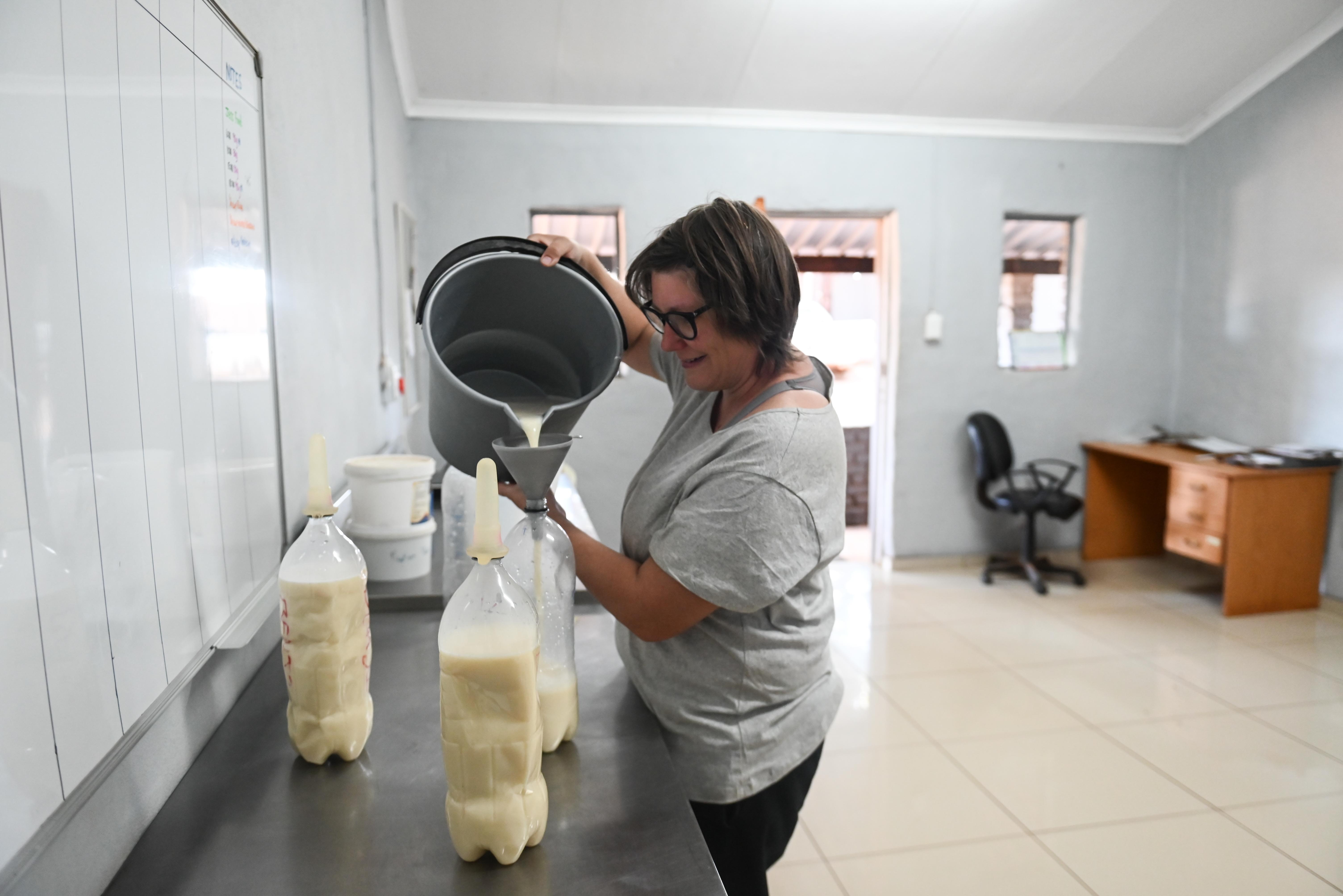 Golola Rhino Orphanage and Rehabilitation Centre -  volunteer preparing milk bottles