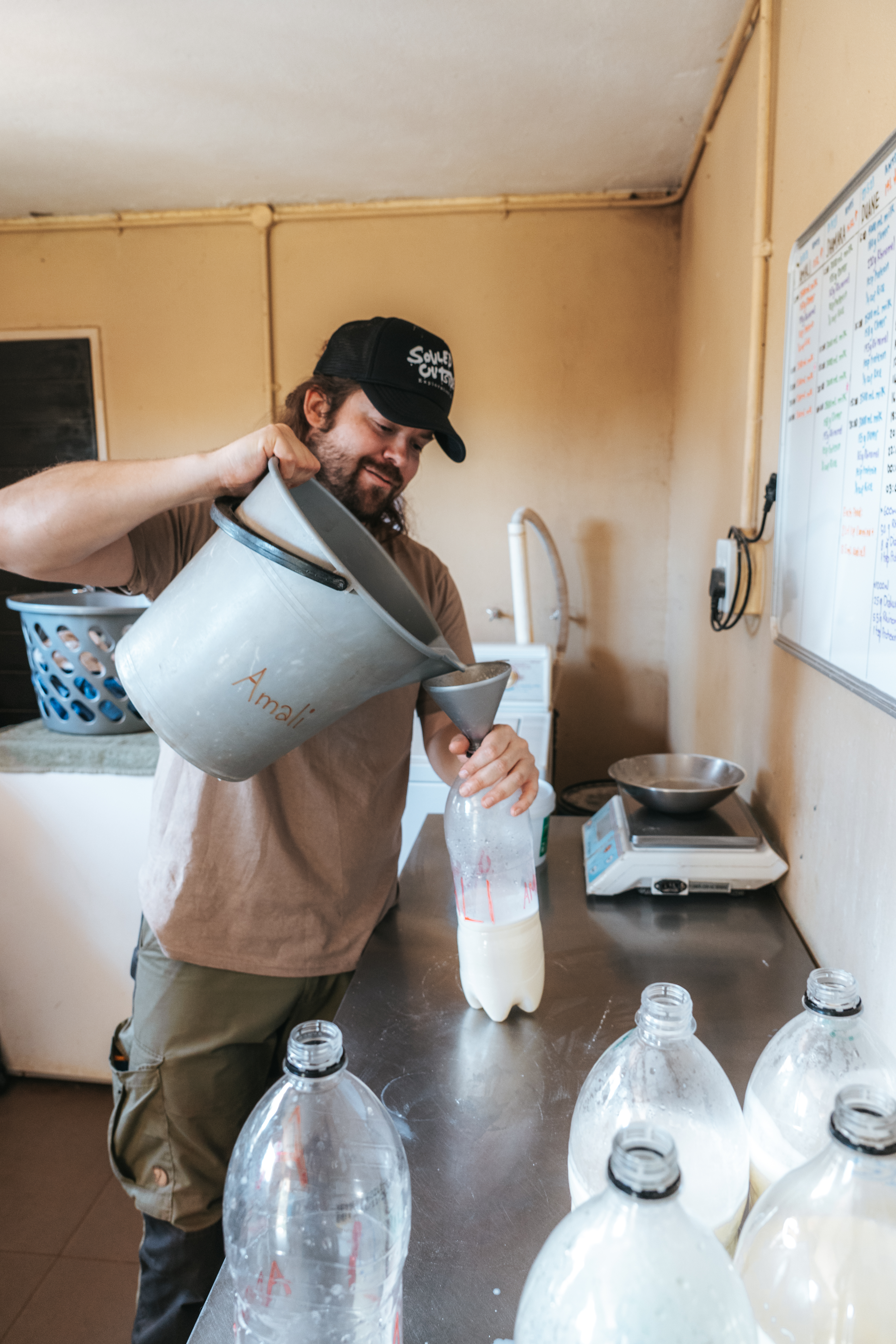 Golola Rhino Orphanage and Rehabilitation Centre - volunteer preparing milk bottles 