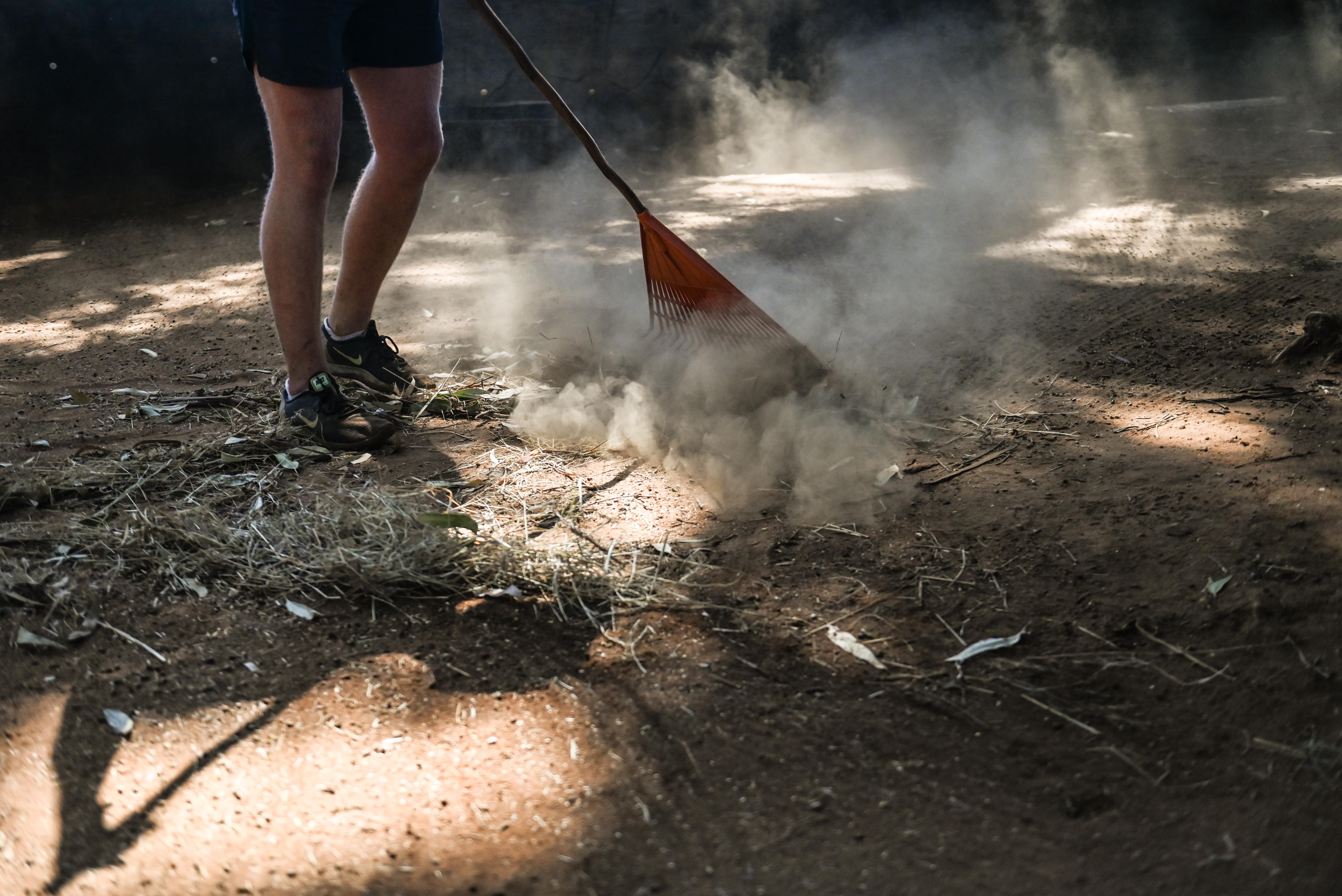 The Immersive Wildlife Rehabilitation Experience - volunteer cleaning an enclosure 