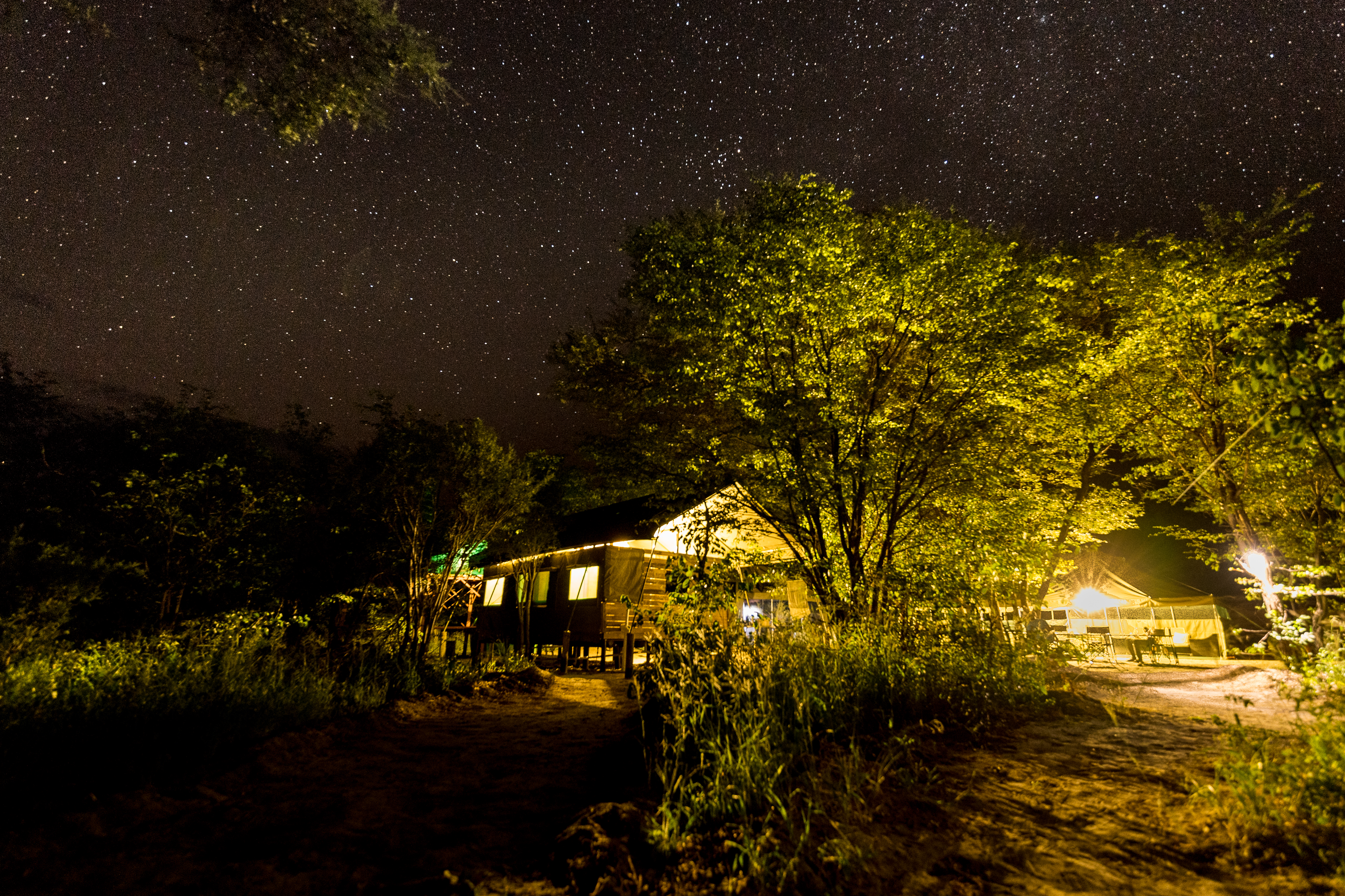 Ethical Holidays In Africa - Wildlife Travel - base camp surrounded by stars in the Okavango