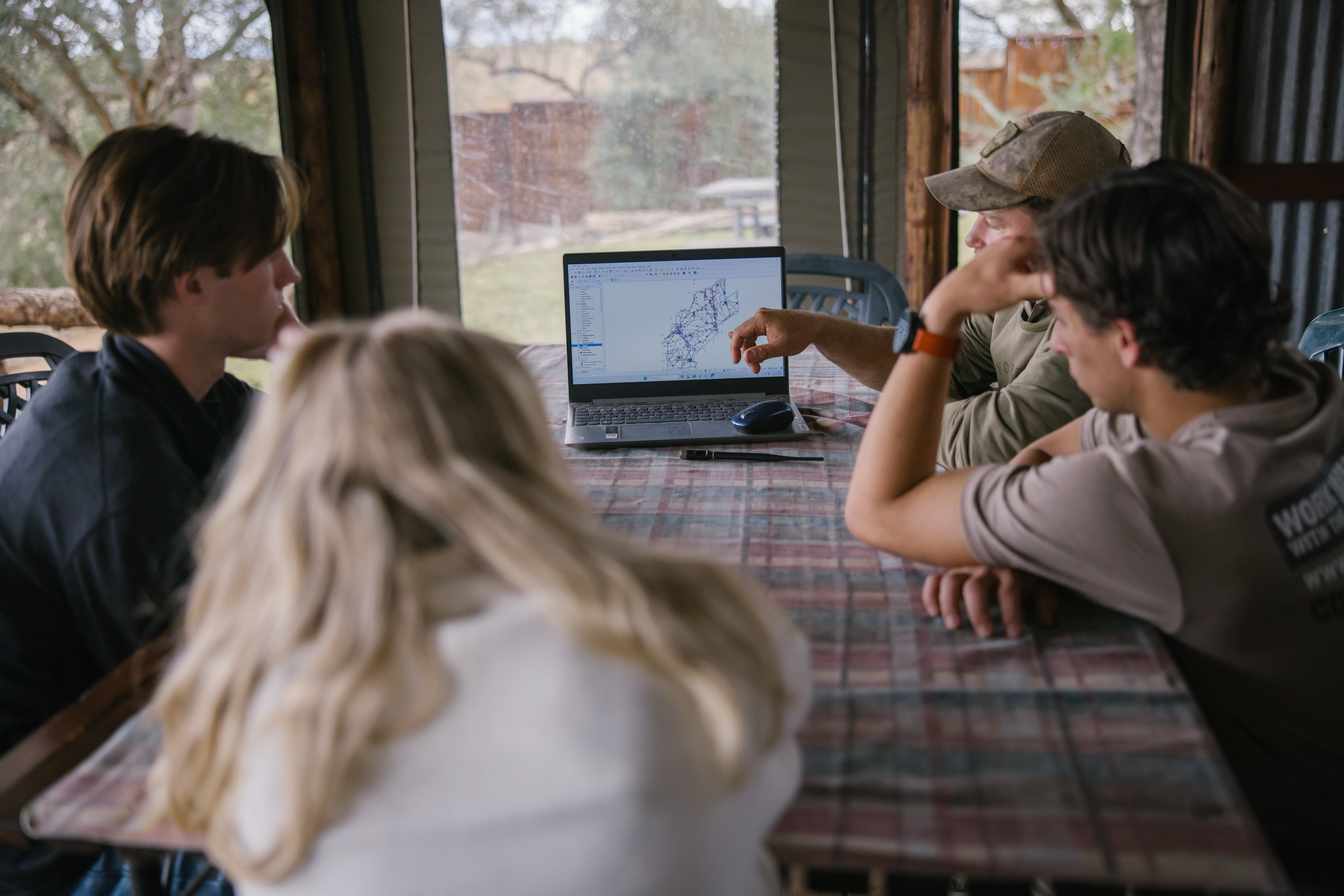 The Three Frontiers Conservation Experience - volunteers learning about the reserve 