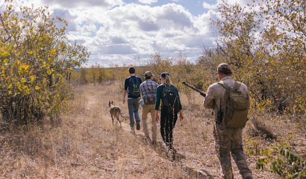 Rhino Conservation Adventure - group out tracking in the bush
