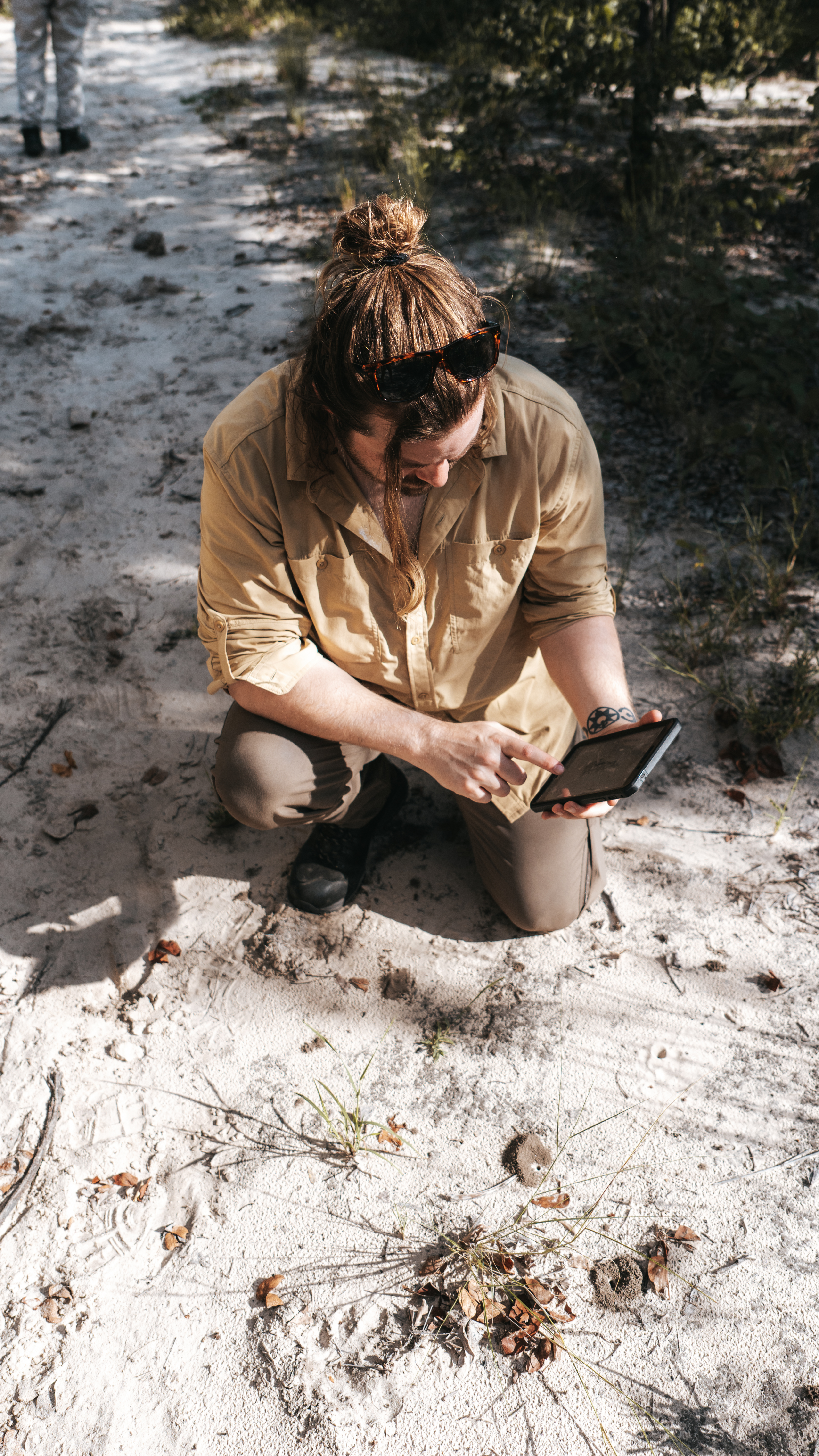 Conservation research internships - Research & Management Internships - Intern monitoring tracks on the Okavango Wilderness Project