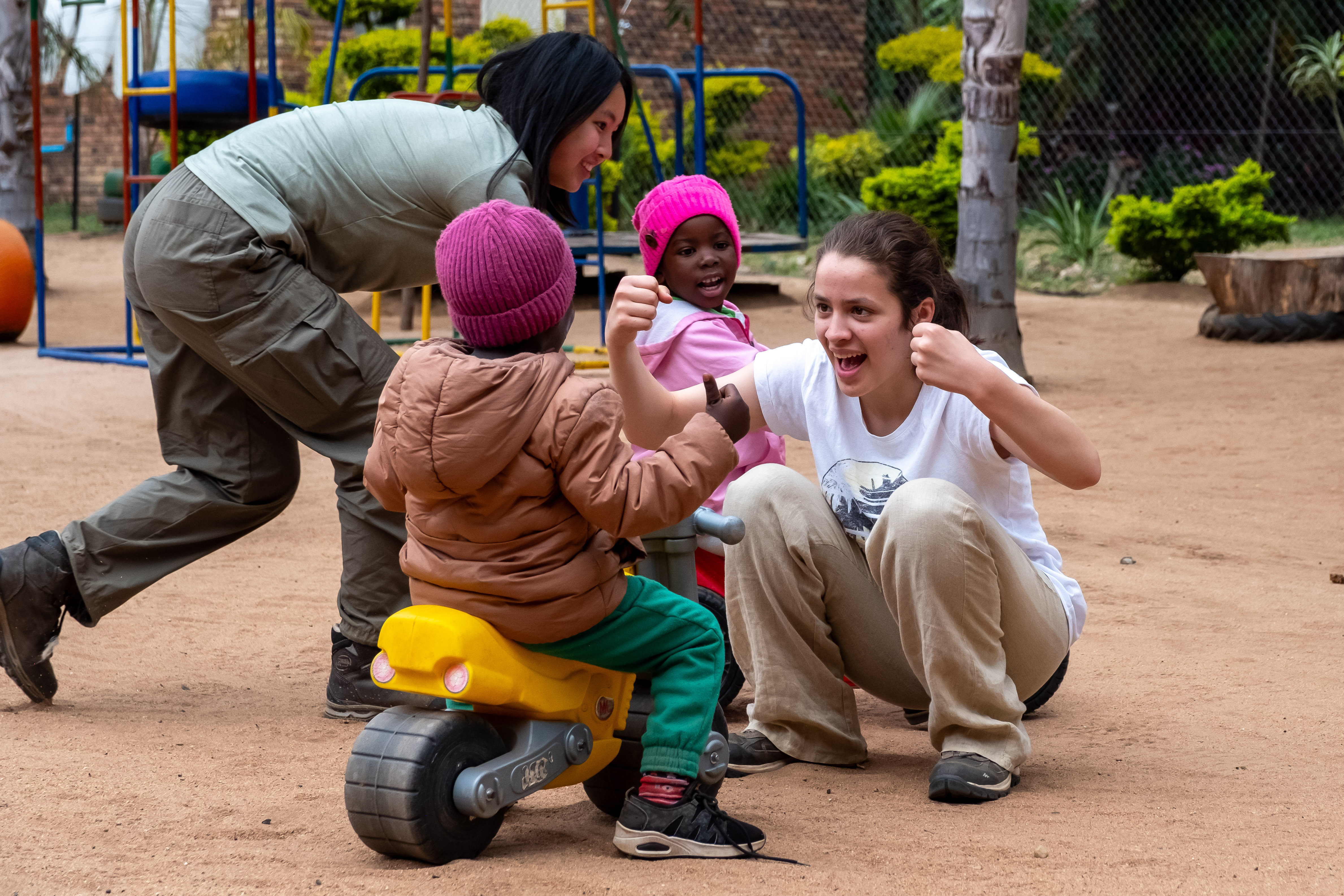 Service learning trips - Service Learning Field Trip - Student playing with kids at a local creche