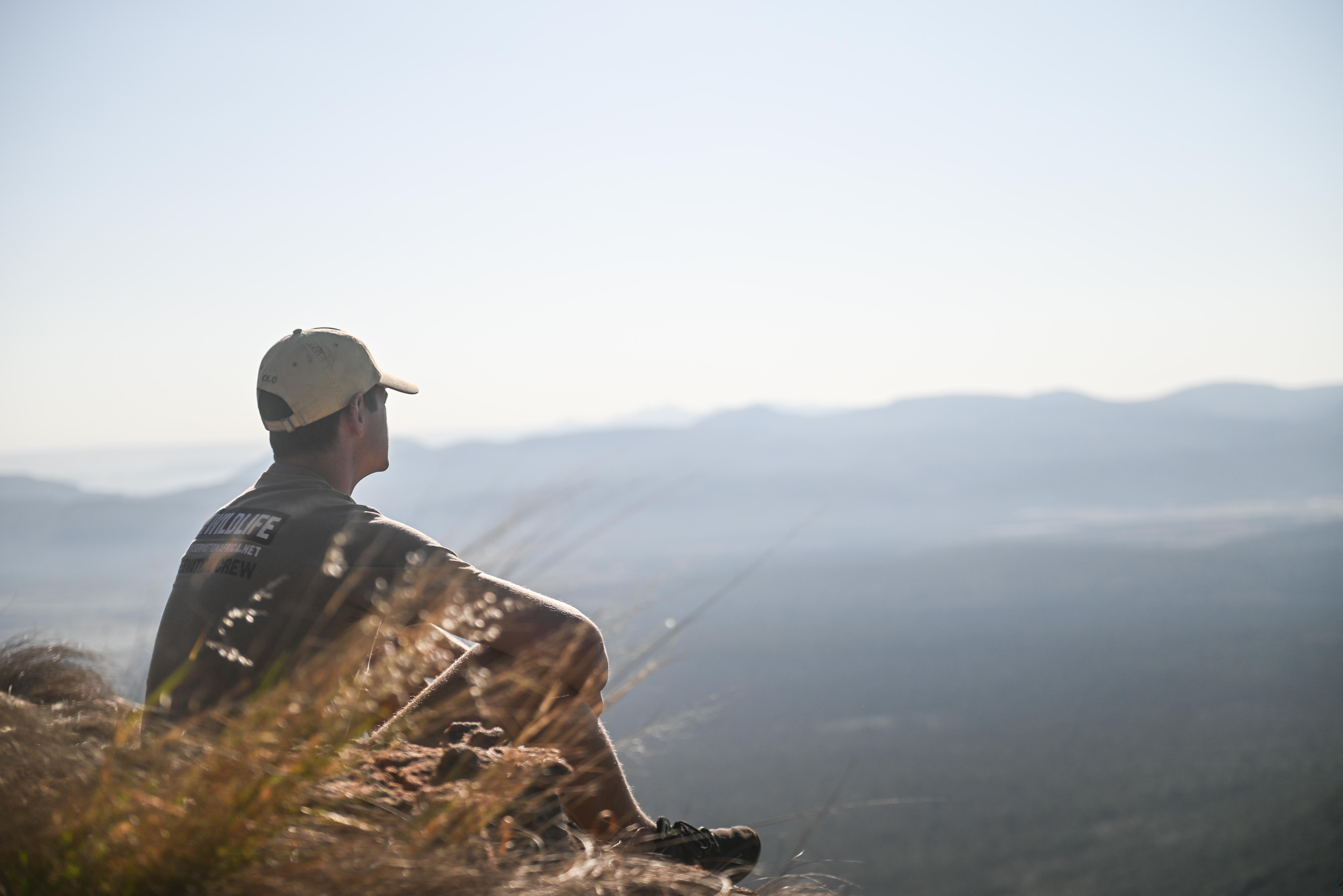 Tailor made travel - Male volunteer viewing the landscape