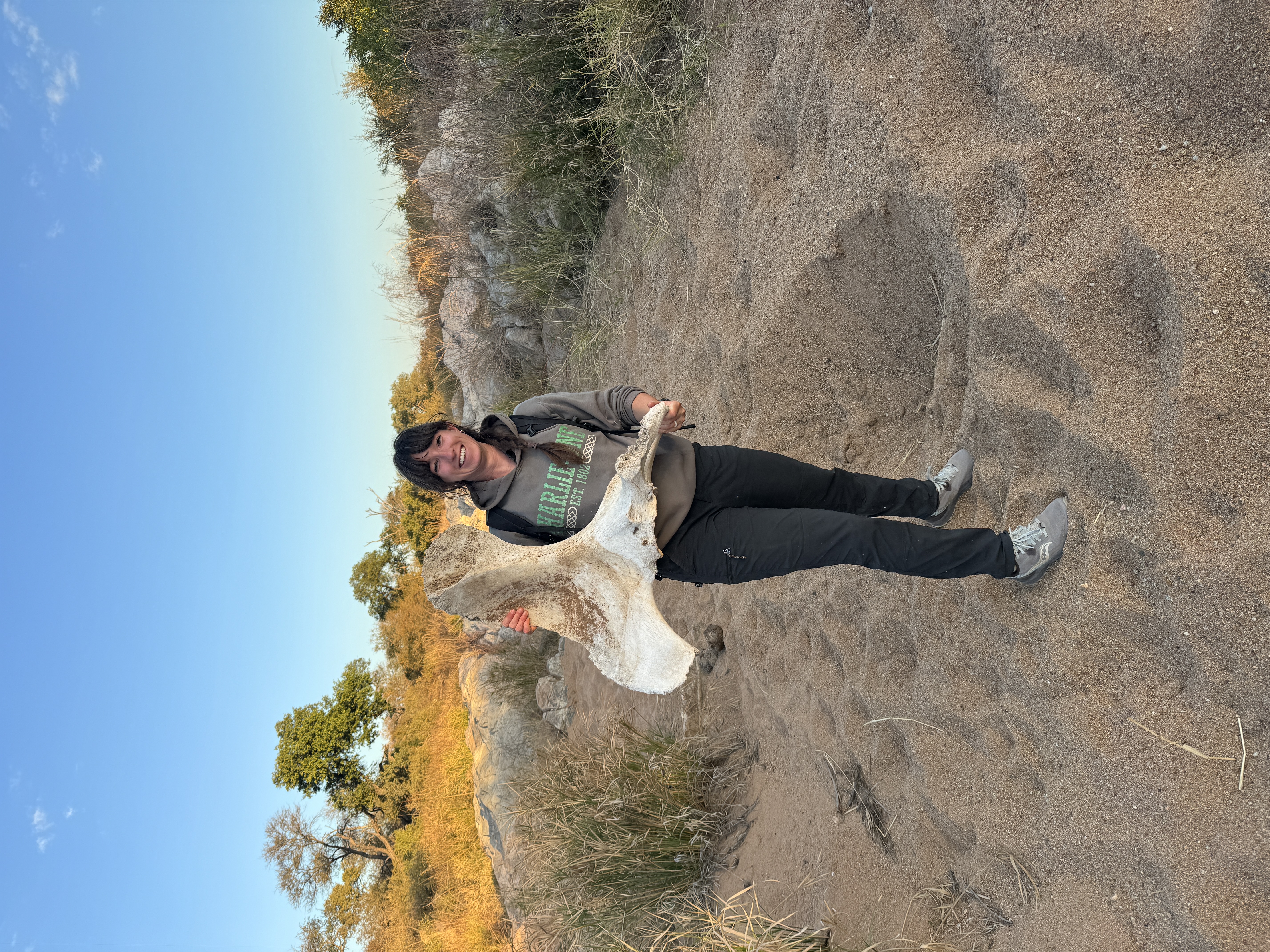 Francesca Weiher - female volunteer holding a skeleton 