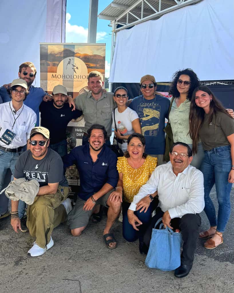 Moholoholo International Wildlife Summit 2025 Blog - Martial, manager of Moholoholo, posing with attendees of the summit 