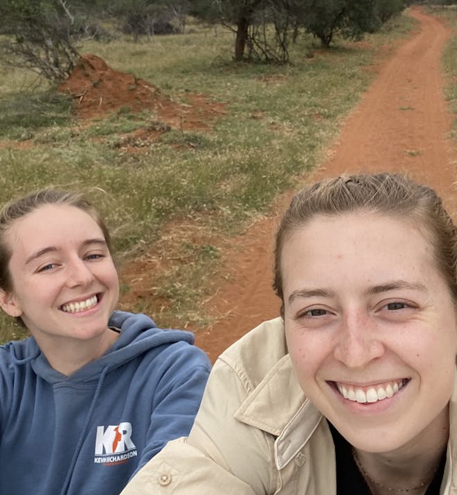 Maelis and Madeline - Two female volunteers on back of vehicle