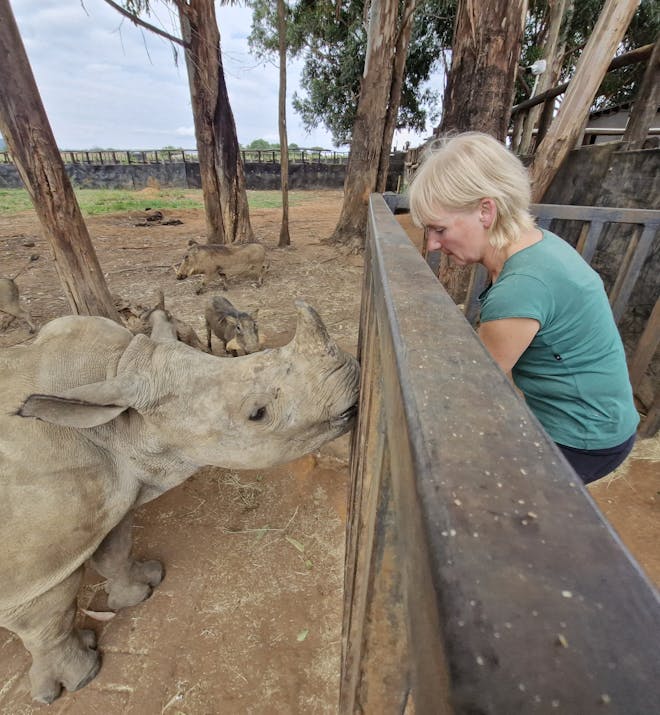 Louise Jane Waugh - Volunteer bottle feeding a rhino