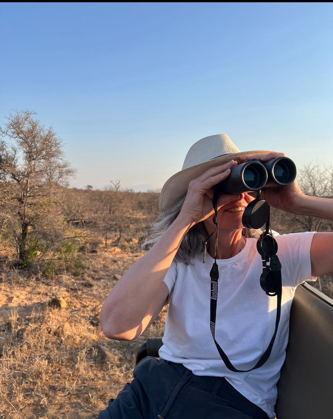 Di Roderick and Sam Hemmingway - Volunteer looking onwards with binoculars 