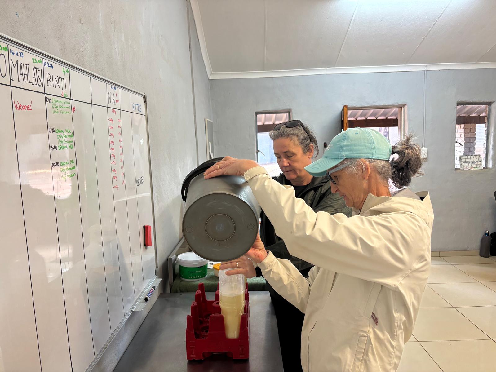 Di Roderick and Sam Hemmingway - Preparing baby rhino milk