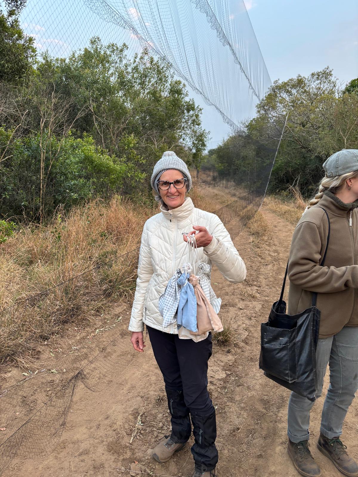 Di Roderick and Sam Hemmingway - Holding a bag of birds whilst bird ringing