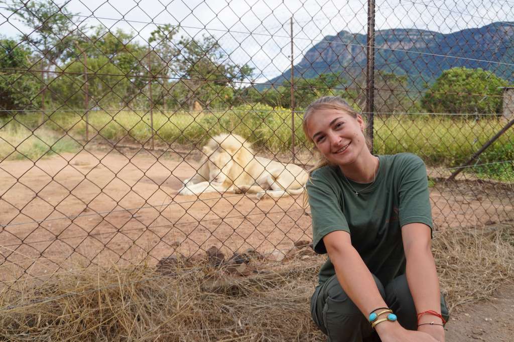 Olivia Ralton - Posing with lion in background