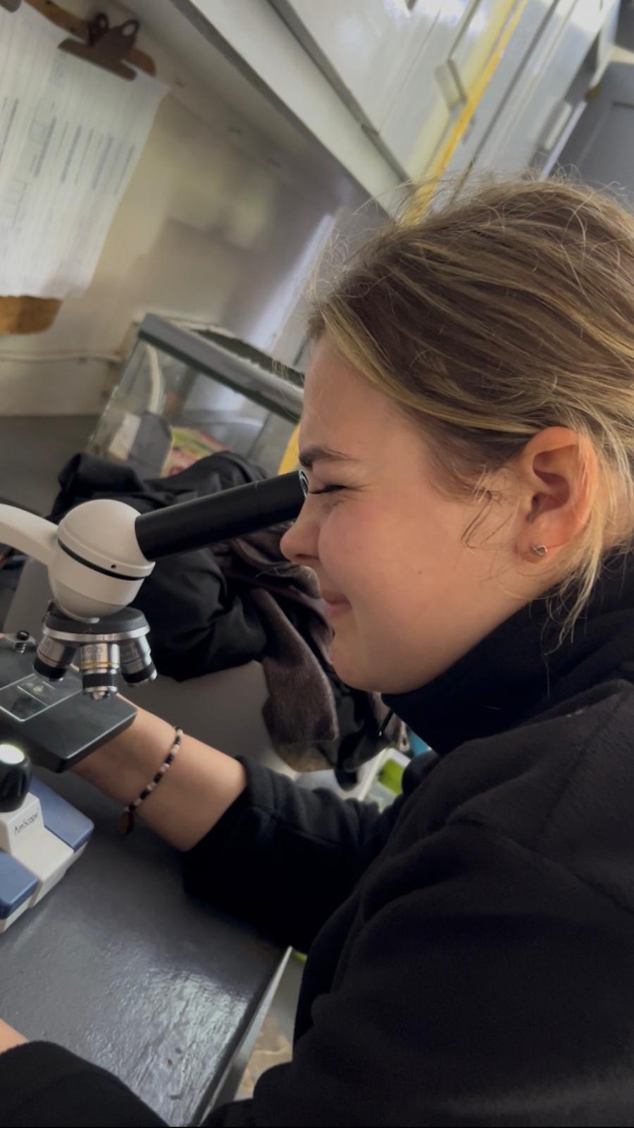 Lydia Cartwright - Looking into a microscope