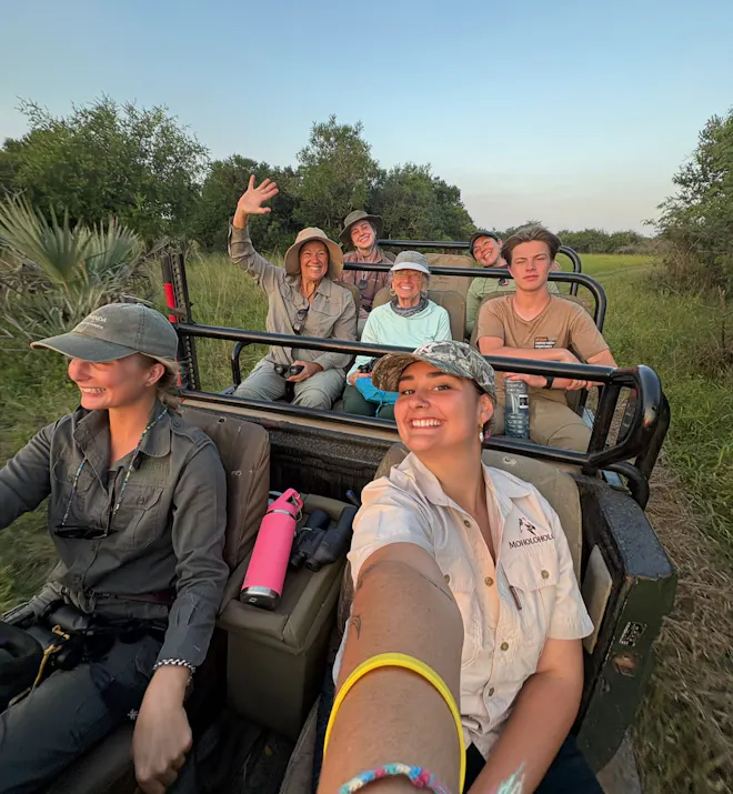 Paige Maine: a group of volunteers posing in their research vehicle