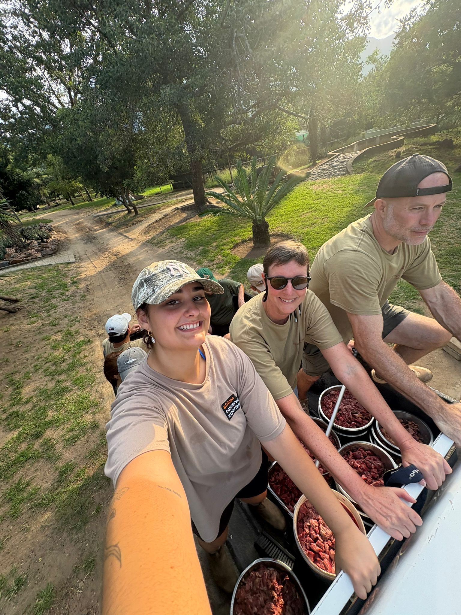 Paige Maine: volunteers posing in the truck on a feed round