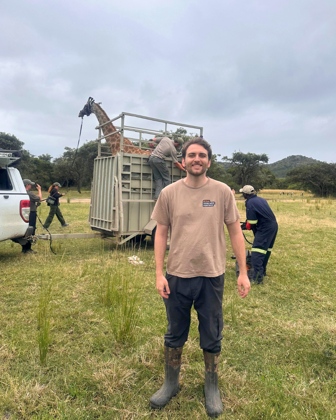 Alexander Parillo - Standing in front of a giraffe getting ready for release from Moholoholo rehabilitation centre