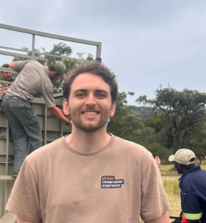 Alexander Parillo - Standing in front of a giraffe getting ready for release from Moholoholo rehabilitation centre
