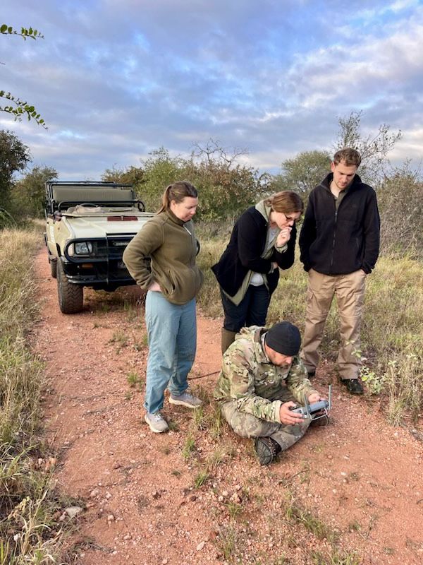 Michelle Revai - Volunteers working with project staff to track animals on Vikela project