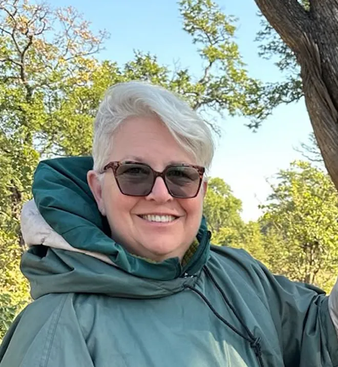 Vittoria Trainer stood next to animal bones in Botswana on the Okavango project