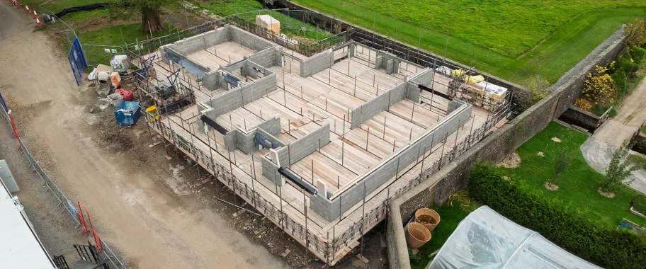 Structural blockwork and floor beams are now in place, giving clear definition to the layout of this future home.