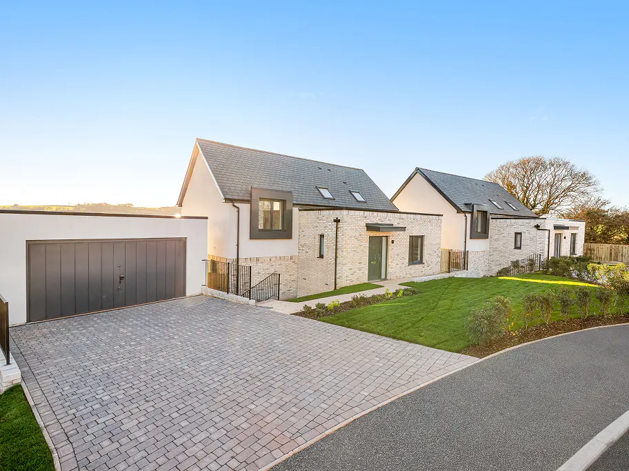 Plots 4 and 5 on a beautiful cloudless day. Both houses are going through final inspections and finishing stages ahead of handover to sales.