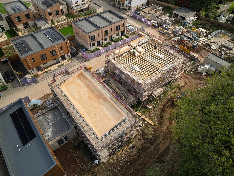 From rooftops to rising frames. Completed homes at Longcroft sit alongside the next generation of houses taking shape on site.