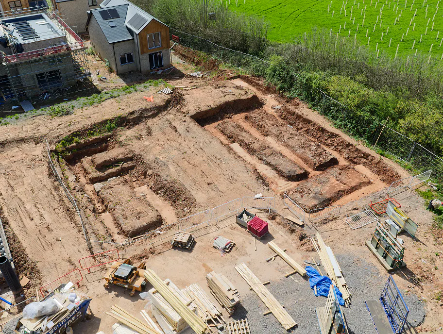 Foundation trenches cut deep into the Somerset earth, as the later plots at Gatcombe Orchard begin to take shape