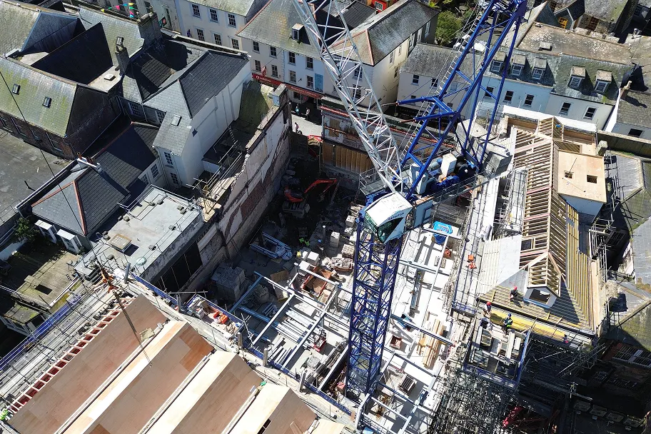 Looking down across the site, the steel frame erection is visible across the phase 3 area alongside the advancing roofworks on plots 9–13.