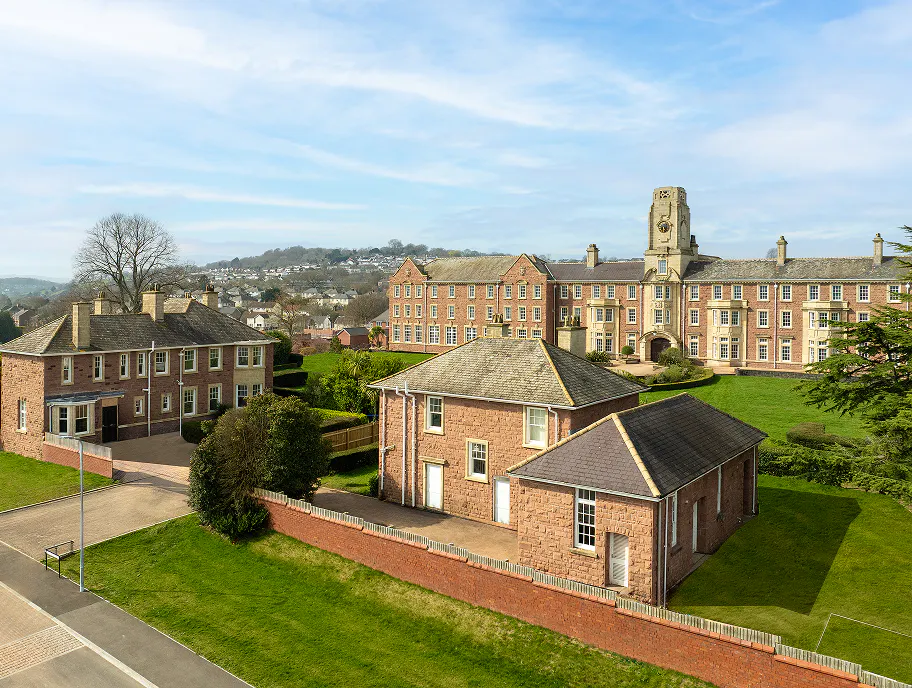 The Tempus site from above, with the four new-build houses and landscaped grounds visible alongside the main listed building.