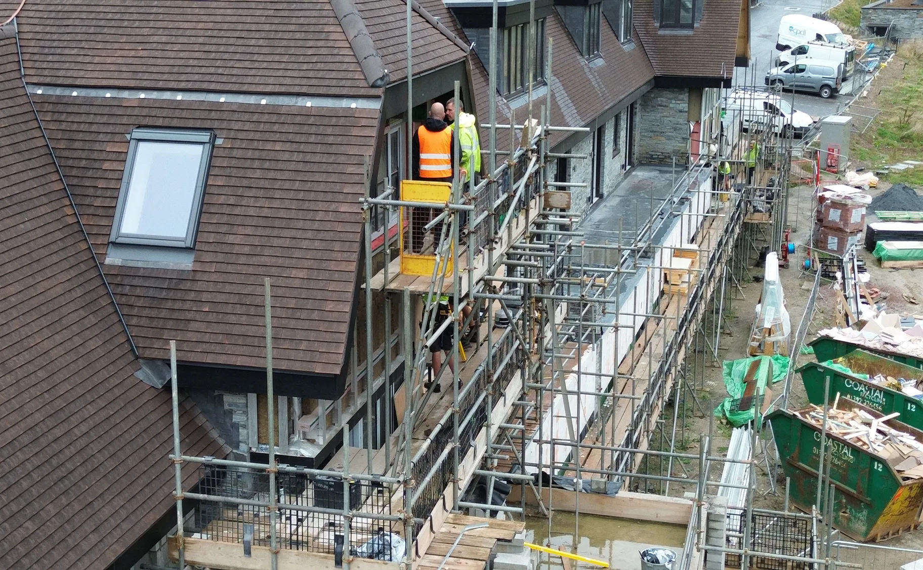 The apartment block takes shape against the North Devon coastline, with external works in their final stages.