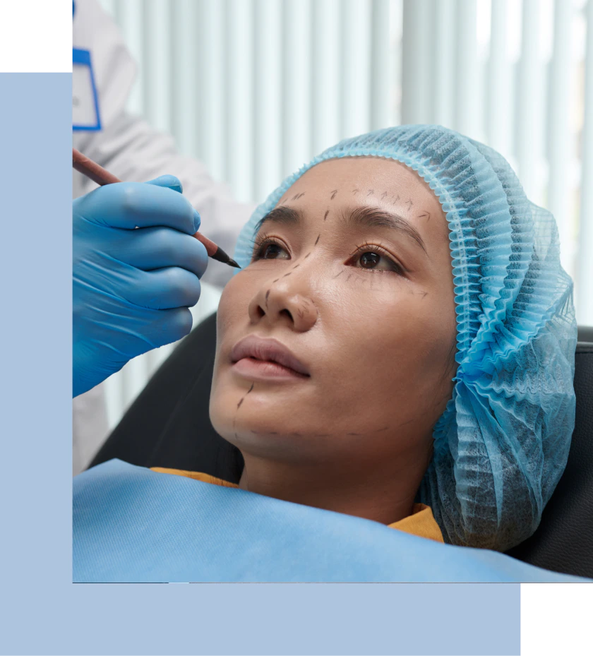A woman being readied for a plastic surgery procedure at a clinic.