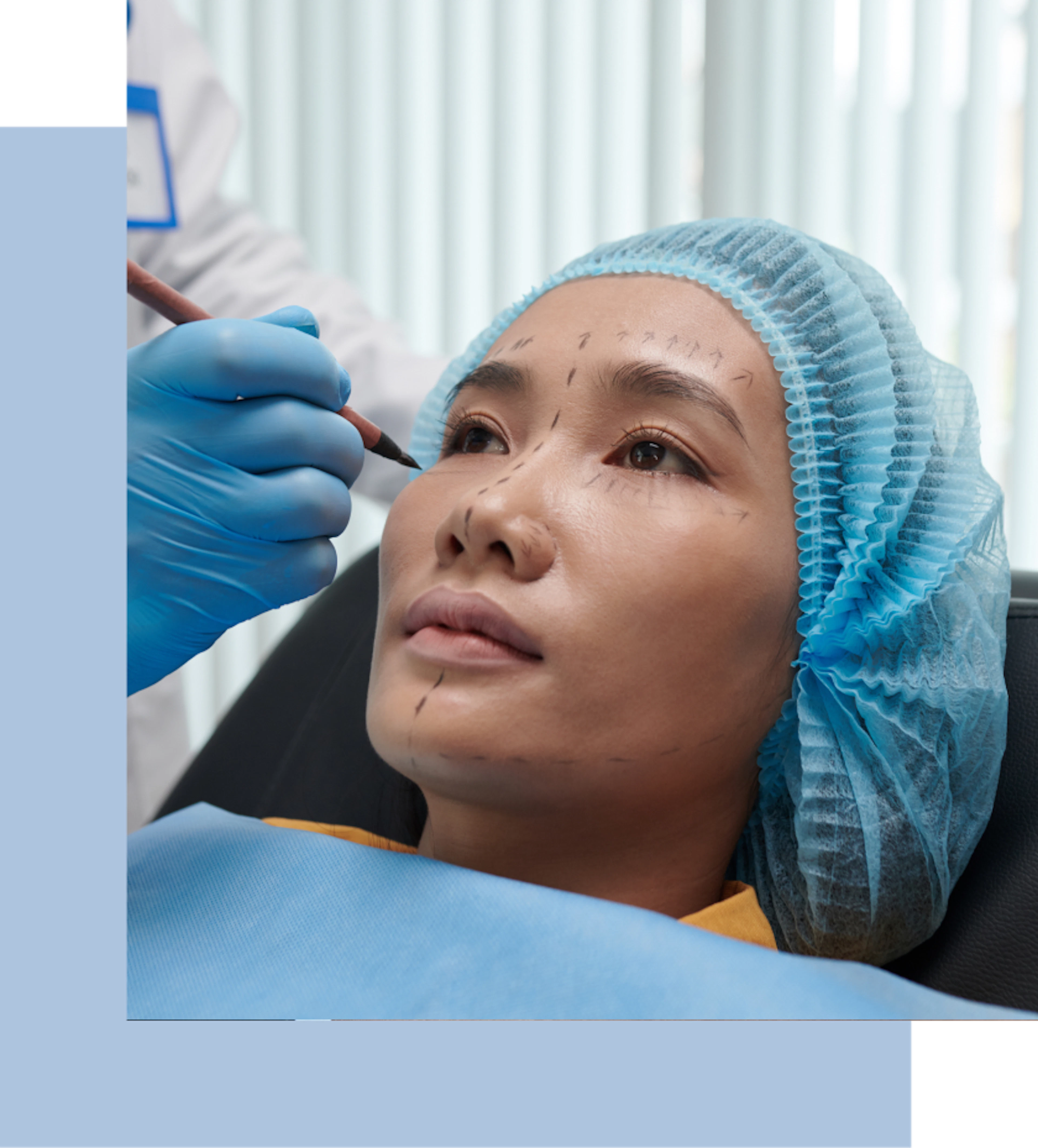 A woman being readied for a plastic surgery procedure at a clinic.