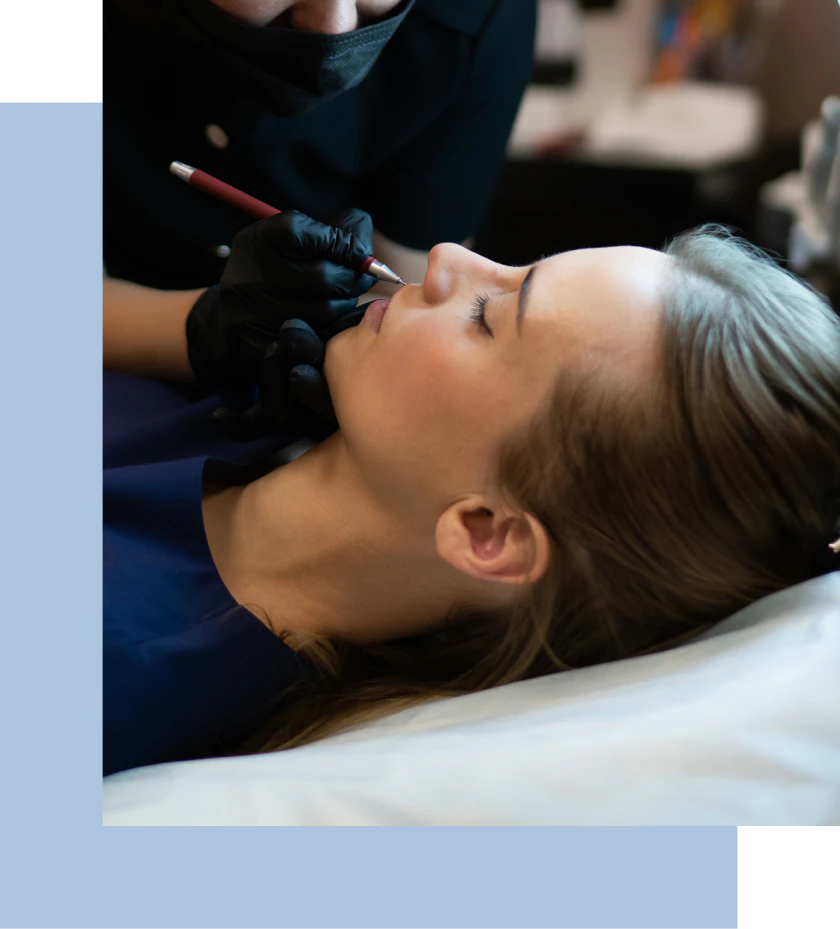 A woman undergoing a procedure, while another woman closely observes the treatment in a beauty salon.
