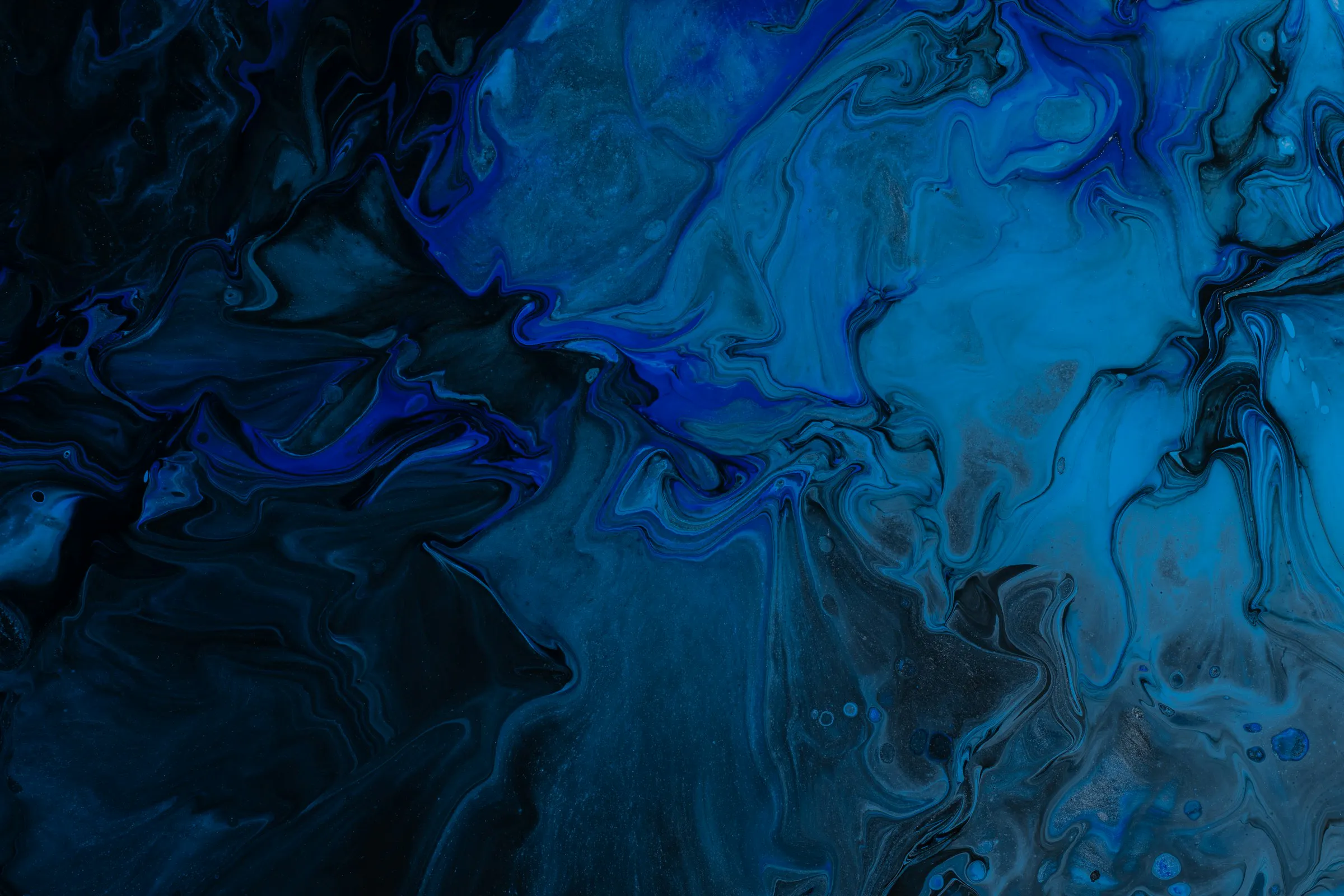 Abstract background featuring a blend of blue and black colors, creating a dynamic and modern visual effect.