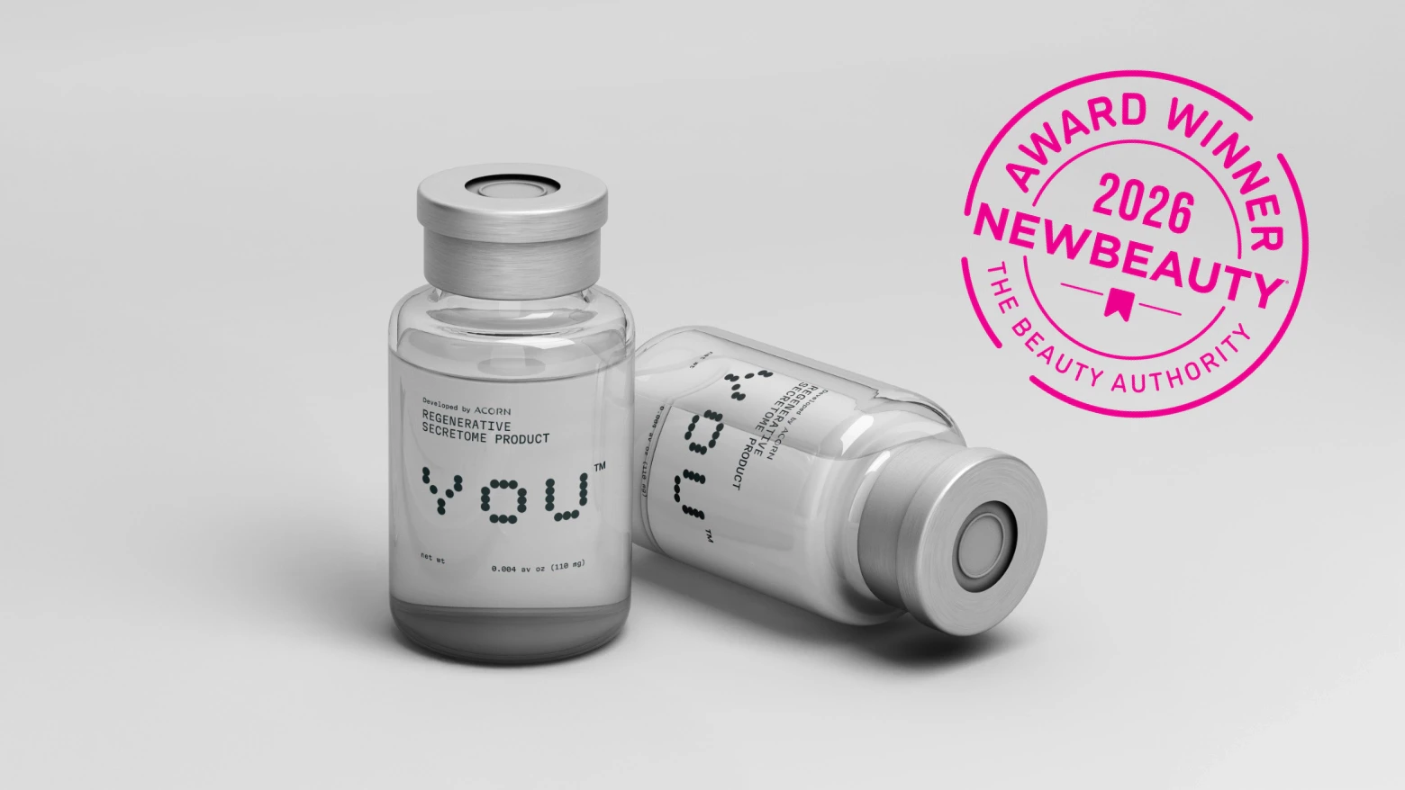 Acorn secretome vials with a pink NewBeauty award seal