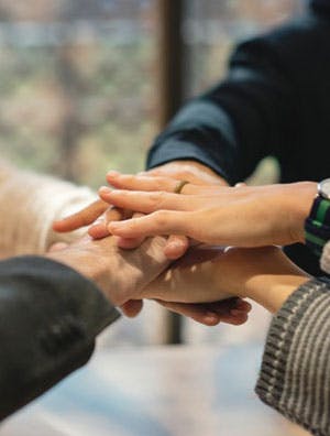 sober coach with client at recovery meeting