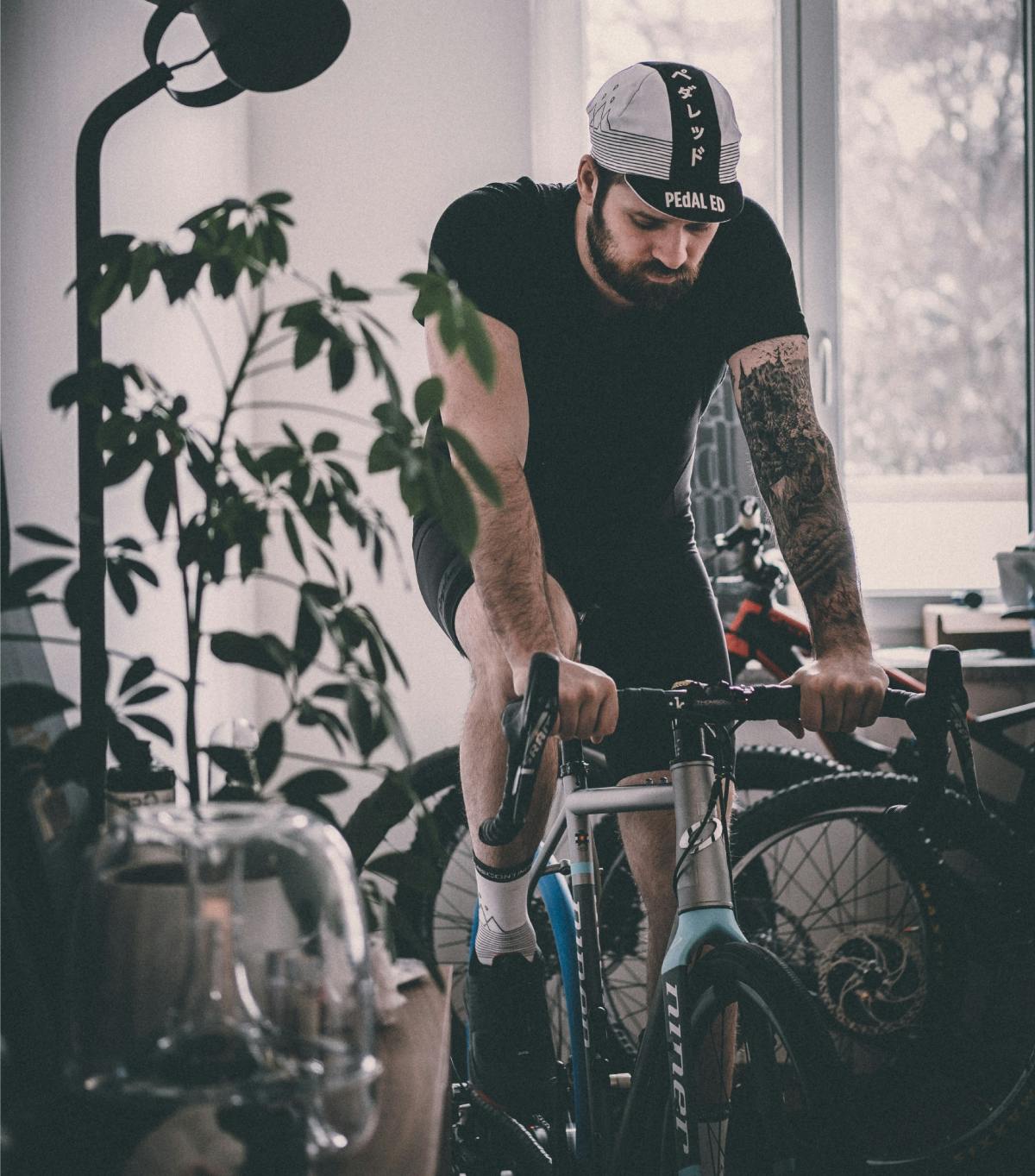 Man cycling at home
